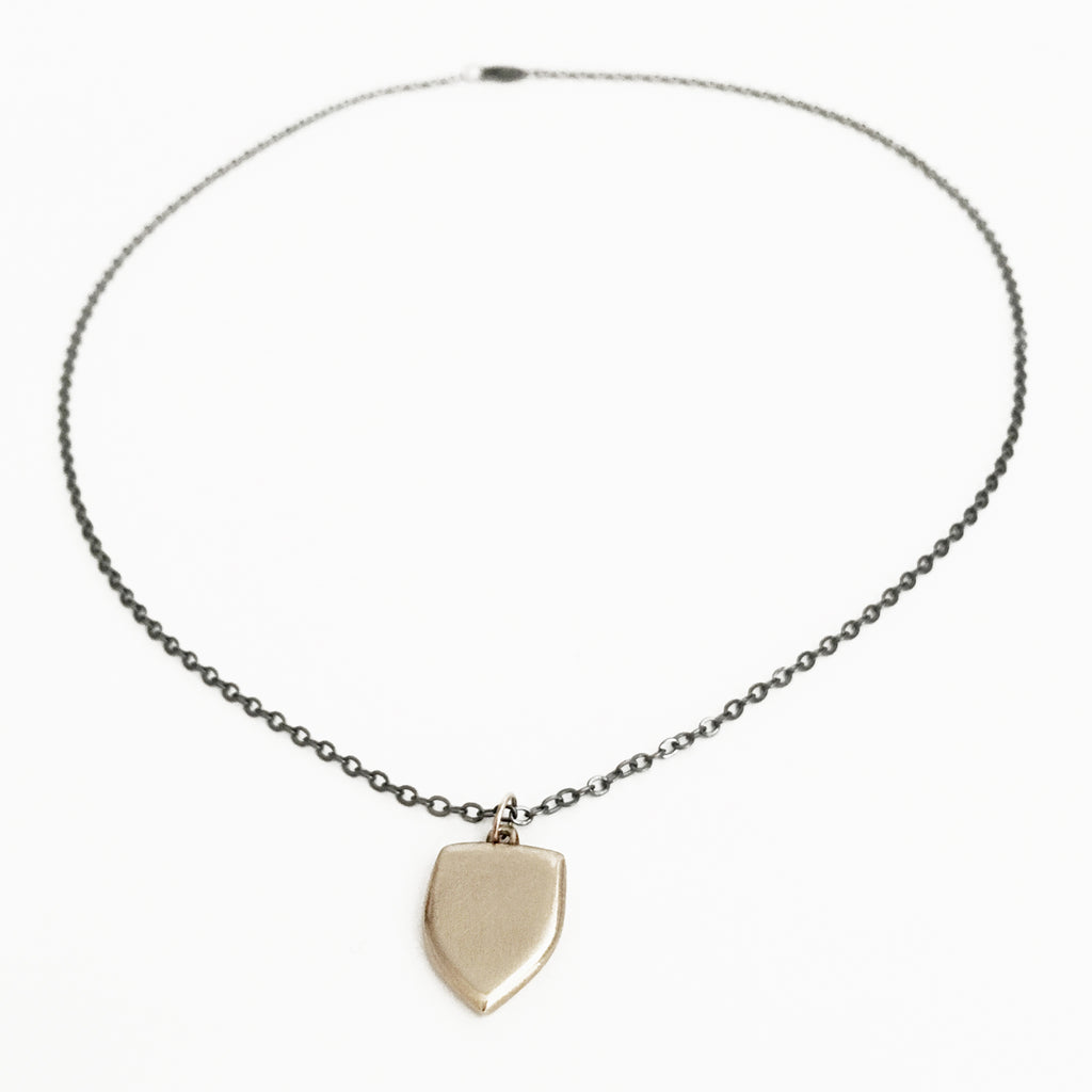 Small (but weighty) solid 10k gold shield charm that is an ideal talisman. Shield measures approx 1/2