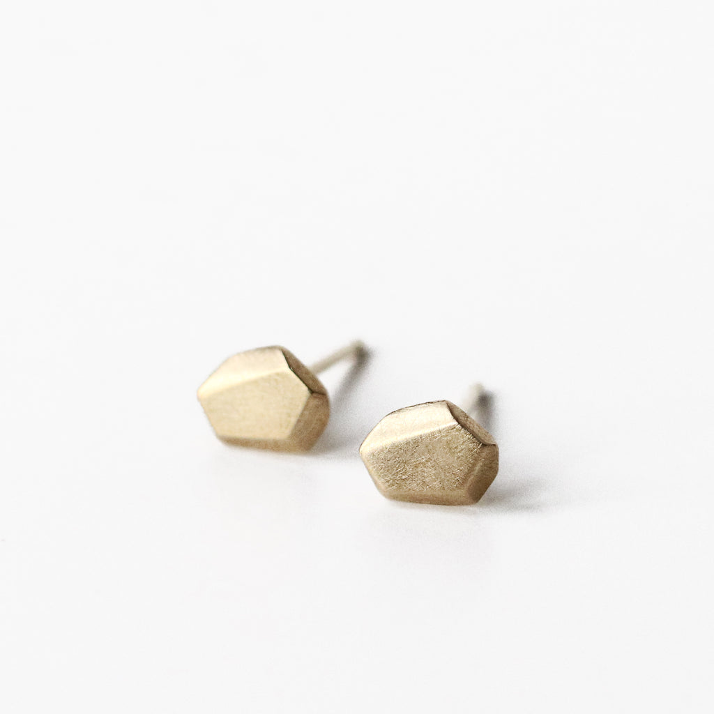 These irregular faceted 10k solid yellow gold nugget posts are ideal for everyday. They are modern, but not hard-edged, and look stunning with pretty much everything.