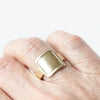 A riff on the classic square signet ring and a cigar band. Solid 10K yellow gold ring. 