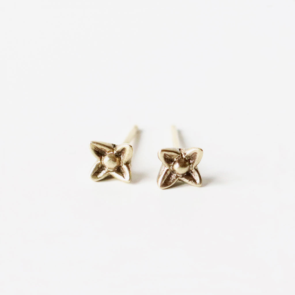 These tiny solid 10k yellow gold sweet woodruff flower post earrings are both delicate and edgy. Small, perhaps, but definitely noticeable. Mix and match with the other posts in this collection. 
