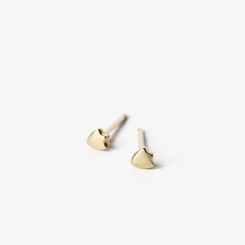 The Swiss shield posts are close friends with the Kite shields, and deserve to be close by. Diminutive in size, but precisely rendered in solid 10k yellow gold. Perfect for the ear with multiple piercings. 